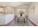 Eat-in kitchen with stainless appliances and white cabinets and dining table at 1221 Renshaw Ct, Cary, NC 27518