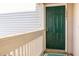 Up close shot of the front door to the home with a green paint color at 1221 Renshaw Ct, Cary, NC 27518