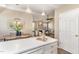 View of the kitchen island, dining area and living room, creating an open and connected living space at 1221 Renshaw Ct, Cary, NC 27518