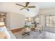 Open-concept living room with hardwood floors and access to the kitchen and dining area at 1221 Renshaw Ct, Cary, NC 27518