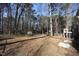 A spacious backyard with a view of the property and fence at 1501 Ramson Ct, Raleigh, NC 27603