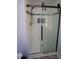 Modern bathroom with white subway tile shower and sliding glass door at 1501 Ramson Ct, Raleigh, NC 27603
