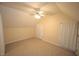 Bedroom featuring carpet, light yellow walls, closet, natural light and a ceiling fan at 1501 Ramson Ct, Raleigh, NC 27603