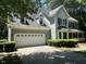 Charming two-story home featuring a front-facing two car garage and traditional architectural elements at 1501 Ramson Ct, Raleigh, NC 27603