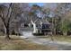 Two-story home with an attached garage, front porch, long driveway, and established landscaping at 1501 Ramson Ct, Raleigh, NC 27603