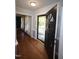 Inviting foyer with wood floors and a view to the front porch and living area at 1501 Ramson Ct, Raleigh, NC 27603
