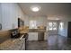Updated kitchen boasts stainless appliances, granite counters, and light-filled breakfast nook at 1501 Ramson Ct, Raleigh, NC 27603