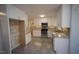 Bright kitchen features white cabinets, stainless appliances, and granite countertops at 1501 Ramson Ct, Raleigh, NC 27603