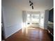 Bright living room with hardwood floors, bay window, and detailed trim at 1501 Ramson Ct, Raleigh, NC 27603