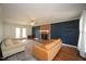 Spacious living room with a brick fireplace, hardwood floors, and plenty of natural light at 1501 Ramson Ct, Raleigh, NC 27603