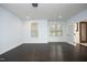 Spacious basement area with light blue walls, wood floors, and a walkout door at 156 Stoney Creek Way, Chapel Hill, NC 27517