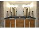 Bathroom features double vanity with dark countertop and dark framed mirrors at 156 Stoney Creek Way, Chapel Hill, NC 27517