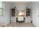 Bright bedroom featuring a built-in desk with storage and a cozy, neutral-toned carpet at 156 Stoney Creek Way, Chapel Hill, NC 27517