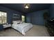 Bedroom featuring neutral carpet, a Queen bed and natural light from three windows at 156 Stoney Creek Way, Chapel Hill, NC 27517