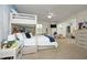 Bright bedroom featuring a bunk bed, white trim, ceiling fan and natural light at 156 Stoney Creek Way, Chapel Hill, NC 27517