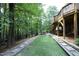Backyard features a professionally installed bocce ball court, fire pit, and easy access to a screened porch at 156 Stoney Creek Way, Chapel Hill, NC 27517