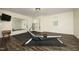 Home gym area featuring a Hydrow rowing machine, mirror, and fitness equipment at 156 Stoney Creek Way, Chapel Hill, NC 27517