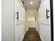 Hallway with hardwood floors and white sliding barn doors at 156 Stoney Creek Way, Chapel Hill, NC 27517