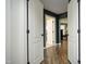 Hallway showcasing an entryway with white trim and natural wood floors at 156 Stoney Creek Way, Chapel Hill, NC 27517