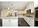 Bright kitchen with granite countertops, stainless steel appliances, and lots of cabinet space at 156 Stoney Creek Way, Chapel Hill, NC 27517