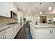 Open kitchen featuring granite counters, stainless appliances, and dark hardwood floors at 156 Stoney Creek Way, Chapel Hill, NC 27517