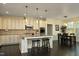 Open kitchen featuring a large island with seating, granite countertops, and stainless steel appliances at 156 Stoney Creek Way, Chapel Hill, NC 27517