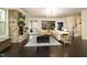 Open-concept living room with hardwood floors, stone fireplace, and a view to the outdoors at 156 Stoney Creek Way, Chapel Hill, NC 27517