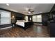 Spacious main bedroom with dark accent wall, wood floors, and natural light at 156 Stoney Creek Way, Chapel Hill, NC 27517