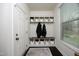 Functional mudroom with built-in storage cubbies, bench, and coat hooks at 156 Stoney Creek Way, Chapel Hill, NC 27517