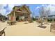 Community outdoor pavilion featuring a stone fireplace, seating, and dining tables for gatherings at 156 Stoney Creek Way, Chapel Hill, NC 27517
