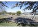 A playground in a neighborhood with swings, benches and green grass at 156 Stoney Creek Way, Chapel Hill, NC 27517