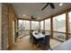 Screened porch with wood floors, ceiling fans and outdoor dining area at 156 Stoney Creek Way, Chapel Hill, NC 27517