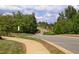 Scenic view of the street, sidewalks, and landscaping within the community at 156 Stoney Creek Way, Chapel Hill, NC 27517