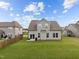 Spacious backyard featuring a lush lawn and a patio, perfect for outdoor activities and relaxation at 190 Hickory Run Ln, Franklinton, NC 27525
