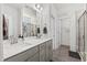 Elegant bathroom with double vanity, modern fixtures, a glass-enclosed shower, and contemporary tile work at 190 Hickory Run Ln, Franklinton, NC 27525