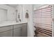 Bright bathroom with neutral tones featuring a vanity and a shower with striped curtain at 190 Hickory Run Ln, Franklinton, NC 27525