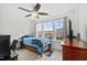 Comfortable bedroom with bed, ceiling fan, and windows, offering a tranquil space at 190 Hickory Run Ln, Franklinton, NC 27525