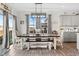 Bright dining area featuring a modern table setting, ample natural light, and seamless kitchen access at 190 Hickory Run Ln, Franklinton, NC 27525