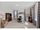 Well-lit home office with neutral decor, featuring a modern desk, comfortable chair, and ample natural light at 190 Hickory Run Ln, Franklinton, NC 27525