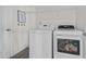 Bright laundry room with full-size washer and dryer, offering efficient laundry solutions at 190 Hickory Run Ln, Franklinton, NC 27525