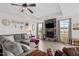Living room with fireplace and windows, creating a cozy and inviting atmosphere for gatherings at 190 Hickory Run Ln, Franklinton, NC 27525