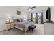 Serene bedroom with neutral decor, plush bed, large windows, and a cozy reading chair creating a relaxing retreat at 190 Hickory Run Ln, Franklinton, NC 27525