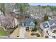 Beautiful aerial view of the green two-story home with a two-car garage and manicured landscaping at 200 Parkbranch Ln, Cary, NC 27519
