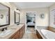 Elegant bathroom with dual vanity and a soaking tub at 200 Parkbranch Ln, Cary, NC 27519