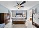 Spacious bedroom featuring a ceiling fan, and natural light streaming through the windows at 200 Parkbranch Ln, Cary, NC 27519