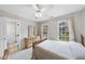 Neutral bedroom with a ceiling fan and a large window with a view at 200 Parkbranch Ln, Cary, NC 27519