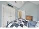 Spacious bedroom featuring blue accent walls, a ceiling fan and carpeted floors at 200 Parkbranch Ln, Cary, NC 27519