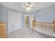 Light blue bedroom with a ceiling fan, closet and carpeted floors at 200 Parkbranch Ln, Cary, NC 27519