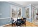 Dining room features hardwood floors, bright windows and neutral paint with direct access to back yard at 200 Parkbranch Ln, Cary, NC 27519