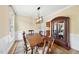 Formal dining room with hardwood floors, elegant lighting, and an ornate china cabinet at 200 Parkbranch Ln, Cary, NC 27519